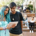 Students looking at tablet