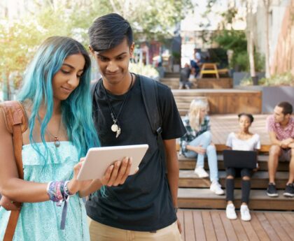 Students looking at tablet