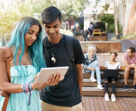 Students looking at tablet